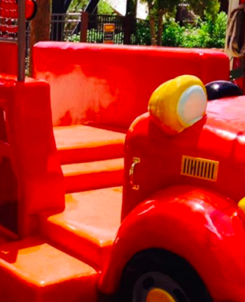 Bright red fire truck play area at Dollywood Firehouse Fun Yard in Owens Farm